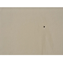 Close-up van een muur met een boorgat