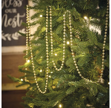 Kerstboom versierd met een zilverkleurige kralenslinger