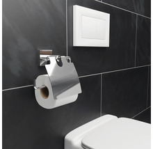 Toiletpapierhouder van metaal met toiletspoeling aan een betegelde wand