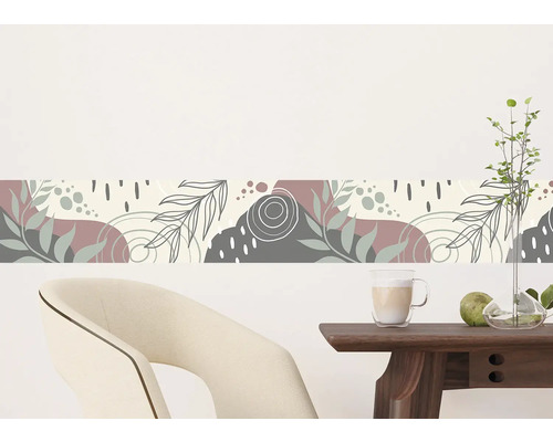 Wandboord met abstract plantenpatroon boven een tafel