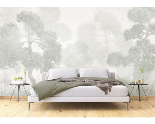 Slaapkamer met fotobehang met bosmotief achter een bed