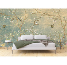 Slaapkamer met fotobehang met vogel- en bloemmotief