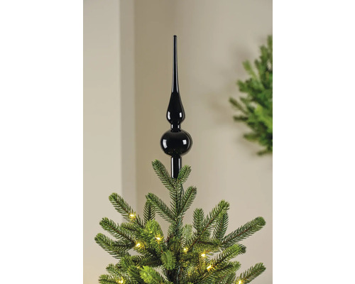 Zwarte kerstboompiek op een kerstboom