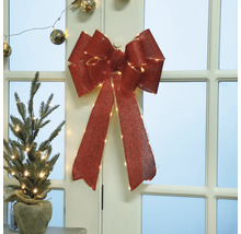 Decoratieve kerstversiering met strik en mini-kerstboom