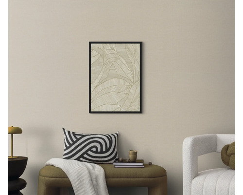 Woonkamer met een ingelijste foto van een bladpatroon