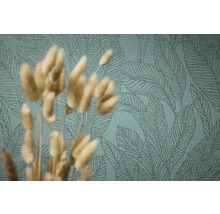 Close-up van een groen behang met bladmotief