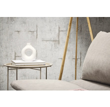 Decoratief behang met betonlook en wapeningsstaaldesign in de woonkamer.