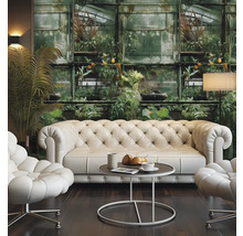 Woonkamer met Chesterfield bank, fauteuils, tafel en fotobehang met plantmotieven