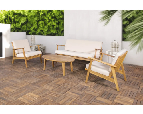 Tuinmeubelset met bank, fauteuils en tafel op een terras