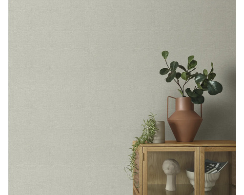 Close-up van een muur met textielbehang in canvaslook