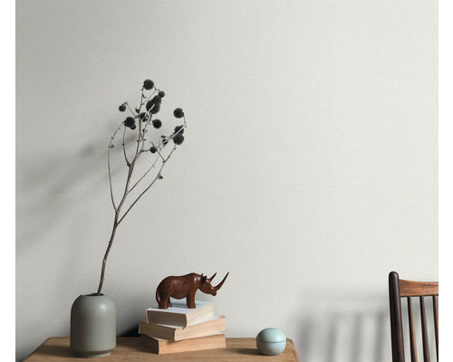 Wanddecoratie met plantendecoratie, stapel boeken en houten figuur