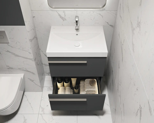 Badkamerwastafel met open lade, wasbak, kraan en badkamerartikelen