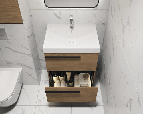 Wastafelonderkast met open lade, wastafel en kraan in een lichte badkamer