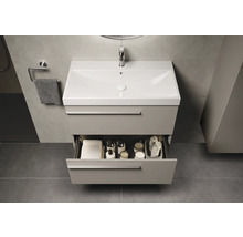 Wastafelonderkast met open lade in badkamer.