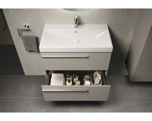 Wastafelonderkast met open lade in badkamer.