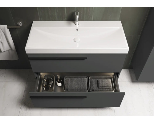 Wastafelonderkast met open lade en wastafel