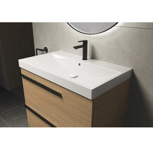 Wastafelonderkast met wastafel en kraan in de badkamer.