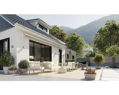 Huis met terras, tuinmeubelen en uitzicht op de bergen