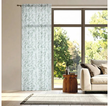 Gordijn met plantenpatroon in een lichte woonkamer