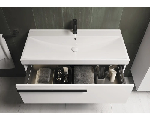 Wastafelonderkast met open lade en wastafel