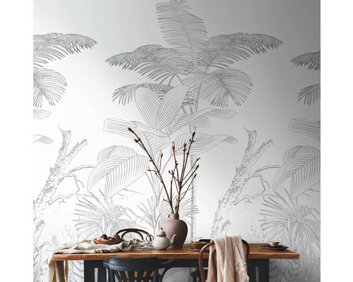 Eetkamer met eettafel en junglebehang met plantmotieven