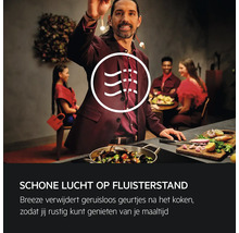 Scene van een geurvrije keuken met mensen die van een maaltijd genieten