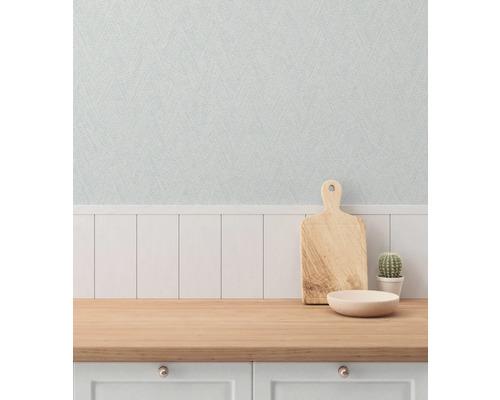 Scène met snijplank, kom en cactus op een aanrecht voor een gestructureerd behang