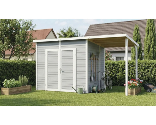 Tuinhuis met aanbouw en tuingereedschap in de tuin