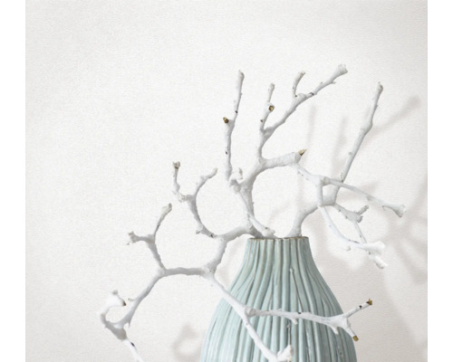 Decoratieve takken in geribbelde vaas