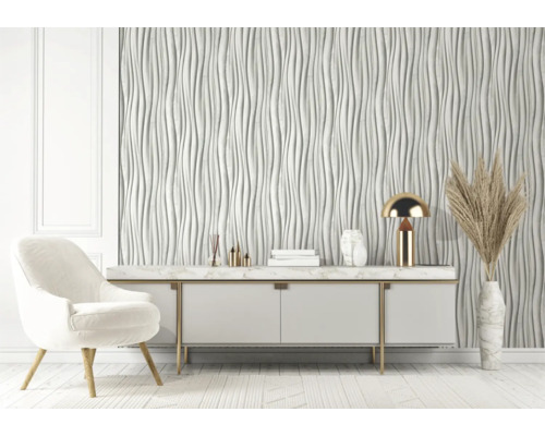 Moderne woonkamer met witte 3D-wandpanelen, dressoir, fauteuil en decoraties