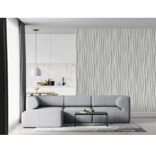 Woonkamer met grijze bank, salontafel en gestructureerde muur