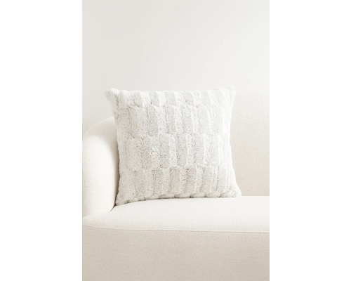 Decoratief kussen met patroon op een bank