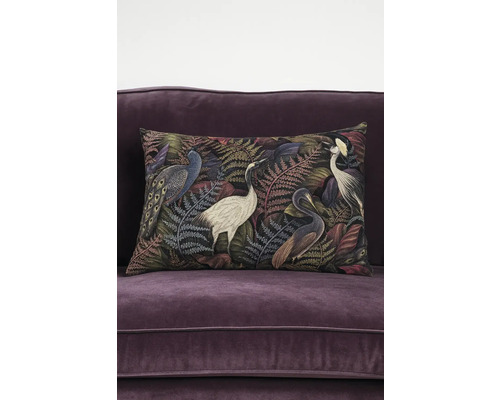 Decoratief kussen met vogelmotief op bank