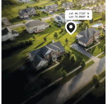 Luchtfoto van een woonwijk met huizen, tuinen en straten