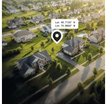 Luchtfoto van een woonwijk met huizen, tuinen en straten