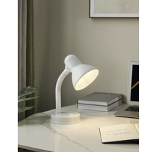 Bureauopstelling met een witte bureaulamp, een notitieboek en een laptop