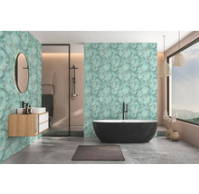 Moderne badkamer met mintgroene marmerlook wand, vrijstaand zwart bad, houten wastafelmeubel en betonlook vloer.