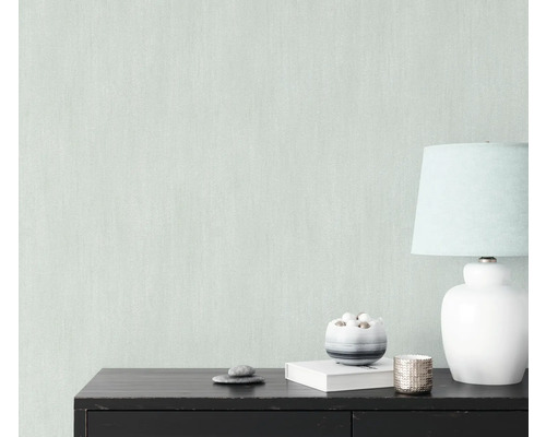 Close-up van lichtgekleurd vliesbehang met een fijne structuur