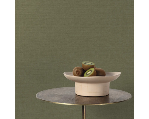 Close-up van een groen vliesbehang met kiwi's op een tafel