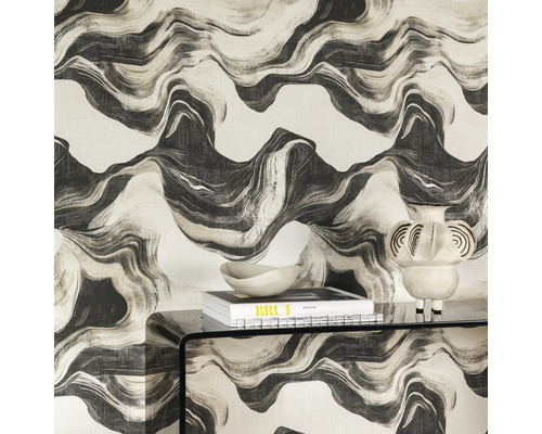 Kamerdecoratie met gedessineerd behang, tafel, boek en decoratie