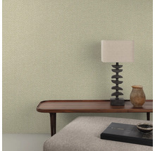 Close-up van een kamer met gestructureerd tapijt en decoratieve elementen