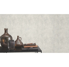 Decoratief behang met pleisterstructuur en vazen op een tafel