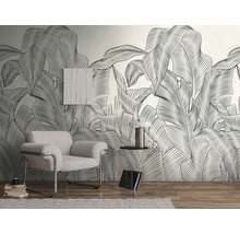 Woonkamer met fauteuil, bijzettafel en grafisch bladbehang