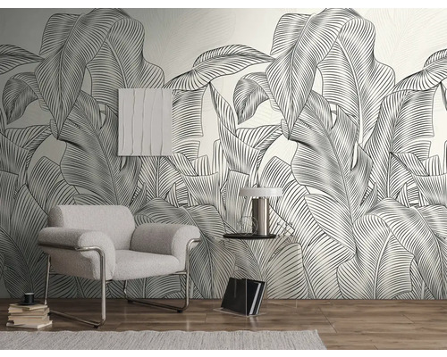 Woonkamer met fauteuil, bijzettafel en grafisch bladbehang