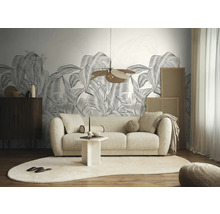 Woonkamer met bank, tafel, vloerkleed en botanisch behang