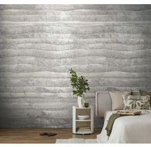 Slaapkamer met een grijs behang met horizontale golvende lijnen op de muur