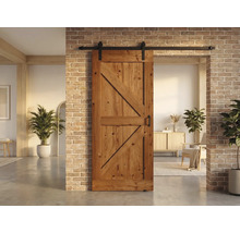 Houten schuifdeur met beslag voor een bakstenen muur