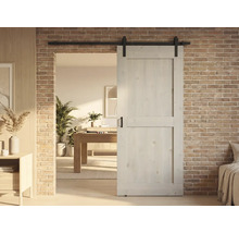 Houten schuifdeur voor bakstenen muur in moderne woonkamer