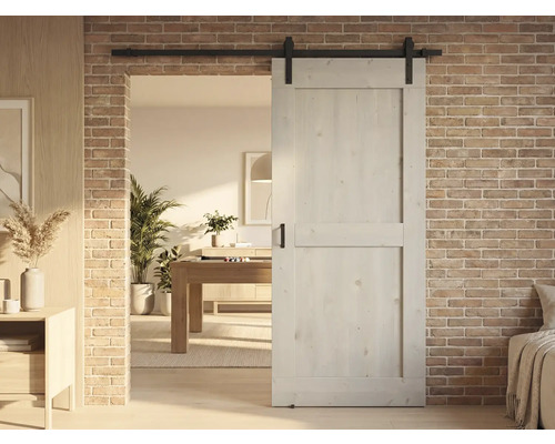 Houten schuifdeur voor bakstenen muur in moderne woonkamer