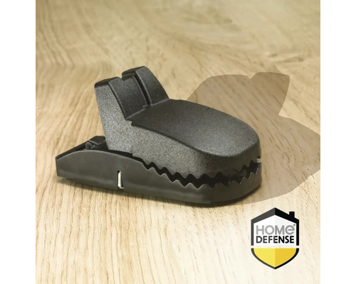 Zwarte muizenval op een houten tafel